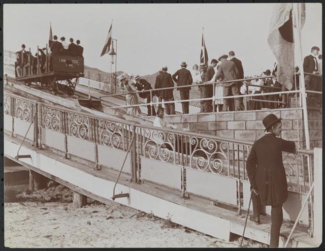 "People ascending an inclined chute in a mechanical car for an amusement boat ride at Coney Island. 1896."